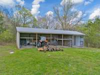 There's even this 5 bay, 62 x 24 tool shed on the property perfect for all your toys. Don't mind Mr. Werewolf... he's a neighborhood favorite at Halloween.