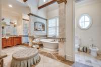 Primary bath - relax and unwind in this spacious gorgeous bathroom with soaking tub, marble shower, and bidet.