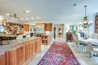 Granite countertops, abundance of cherry cabinets, and a breakfast eating area.