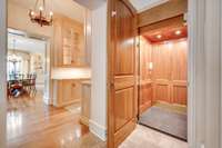 Wood paneled elevator ensuring ease and access for all.