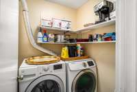 Laundry room with storage on main floor.