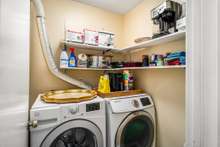 Laundry room with storage on main floor.