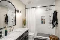 Luxurious primary bathroom has been completely updated and upgraded.