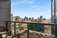 Balcony off the kitchen is the perfect place to enjoy your morning cup of coffee while taking in the ever-changing skyline of the city.