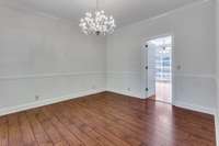 formal dining room ,  crown molding and chair railing