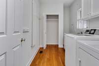 Nice laundry room has built in ironing board, utility sink and closet. Washer and dryer remain.
