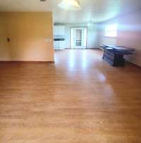 Living room opens up to the kitchen.