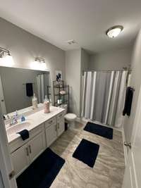 Large secondary bathroom with tub/shower combo.