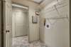 THE 5 X 5 LAUNDRY ROOM WITH WIRE SHELVING.