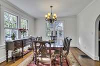 Formal dining room with lots of natural light.