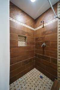 Tile shower in second full bath.