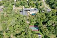 A full sport court sits towards the back of the property between the pool and the renovated barn.