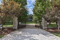 The grand main entrance is one of 3 gated entrances to the property.