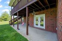 The walk out covered porch from the basement.  There is a gas grill hookup located here.