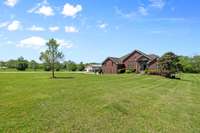 What a serene front yard of a beautiful all brick home with full size walk out finished basement!