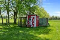 Chicken Coop can remain or seller will remove. The chicken coop adds a touch of rustic charm.