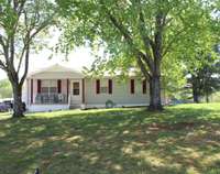 Beautiful shaded front yard. Sit on the porch and enjoy the peacefullness.