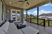 Covered porch perfectly situated to enjoy the evenings as the sun sets.