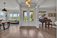 You are welcomed with an open foyer that floods into multiple living spaces.