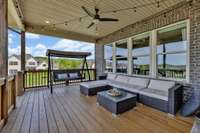 Covered porch perfectly situated to enjoy the evenings as the sun sets.