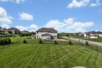 Fully irrigated, level, and fenced backyard.