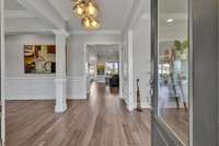 You are welcomed with an open foyer that floods into multiple living spaces.