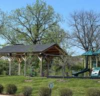 Steps from the parking area is the playground area and sidewalks