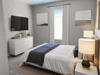 Second bedroom - Virtually staged -  located at the front of the home Downstairs with full bath adjacent