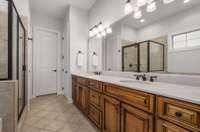 Primary Bath has double vanities, a garden tub, separate shower and large linen closet.