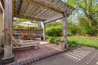 The beautiful brick patio with pergola is an ideal place to relax at the end of the day.