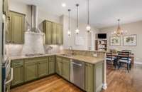 Handsome Kitchen with eat-in Breakfast Room leads to the Laundry room and Garage.
