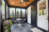 second view of first floor screened porch. The other door is to a closet that is perfect for yard, holiday or patio cushions