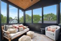 The third story screened deck is the perfect place for morning coffee or afternoon naps