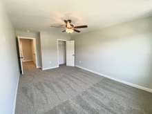 Bedroom 2 at 16'x11' (photo is of model home with same floor plan)