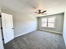 Bedroom 2 at 16'x11' (photo is of model home with same floor plan)