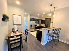 Dining space and bar top dining available (photo is of model home with same floor plan)