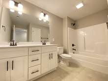 Upstairs hall bathroom (photo is from staged model home with same layout)