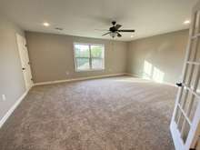 Large bonus room on second level, with closet (photo is from staged model home with same layout)