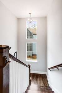 View of hardwood stairs from the upstairs landing