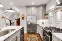 Gas range with gas convection oven. Subway tile backsplash