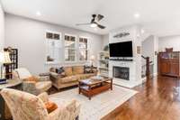 Open living space with hardwoods. Recessed lighting. Gas logs and built in shelving.