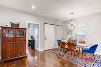 Separate dining room nearby and the barn door leads to a large walk in pantry