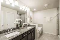 The primary suite bath is huge! Double sinks and loads of storage is a plus. You'll also love the water closet.