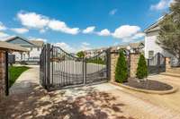 Nicely manicured and gated entrance.