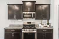 Stainless appliances are a great addition to this kitchen and there is a gas range!