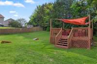 A large wooden deck with a shade cover creates an inviting space for relaxing and entertaining in any weather.809 Brooksdale Dr Smyrna, TN 37167