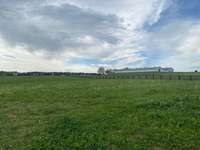 Beautiful horse training facility to the right behind the home