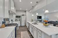 Gas range, recessed lighting, stainless appliances