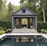 Photo is for inspirational purposes. Current detached garage could be turned into a pool house with a similar aesthetic.