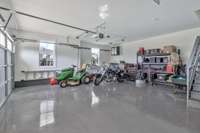 Discover convenience and style in the two-car garage, featuring a sleek epoxy floor that enhances both durability and aesthetics.